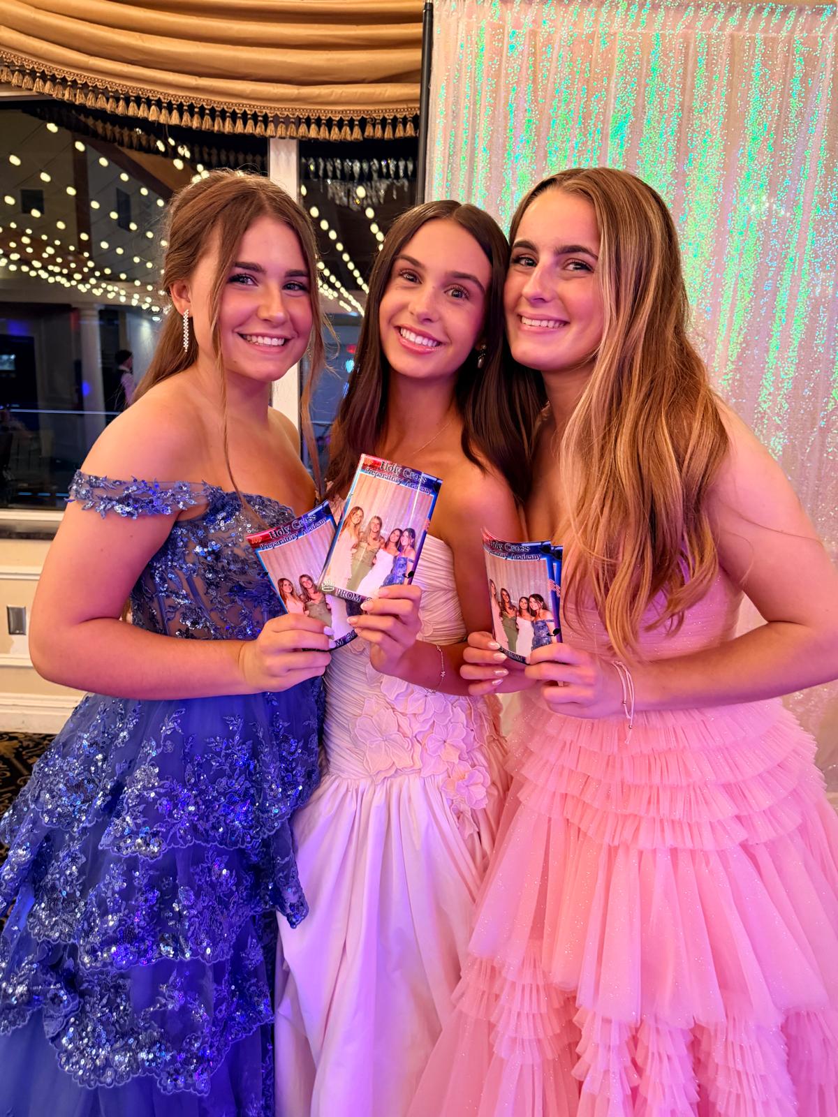 Happy guests with photo strips
